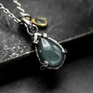 Tiny teardrop cabochon labradorite pendant necklace in silver bezel and prongs setting with green tourmaline gemstone