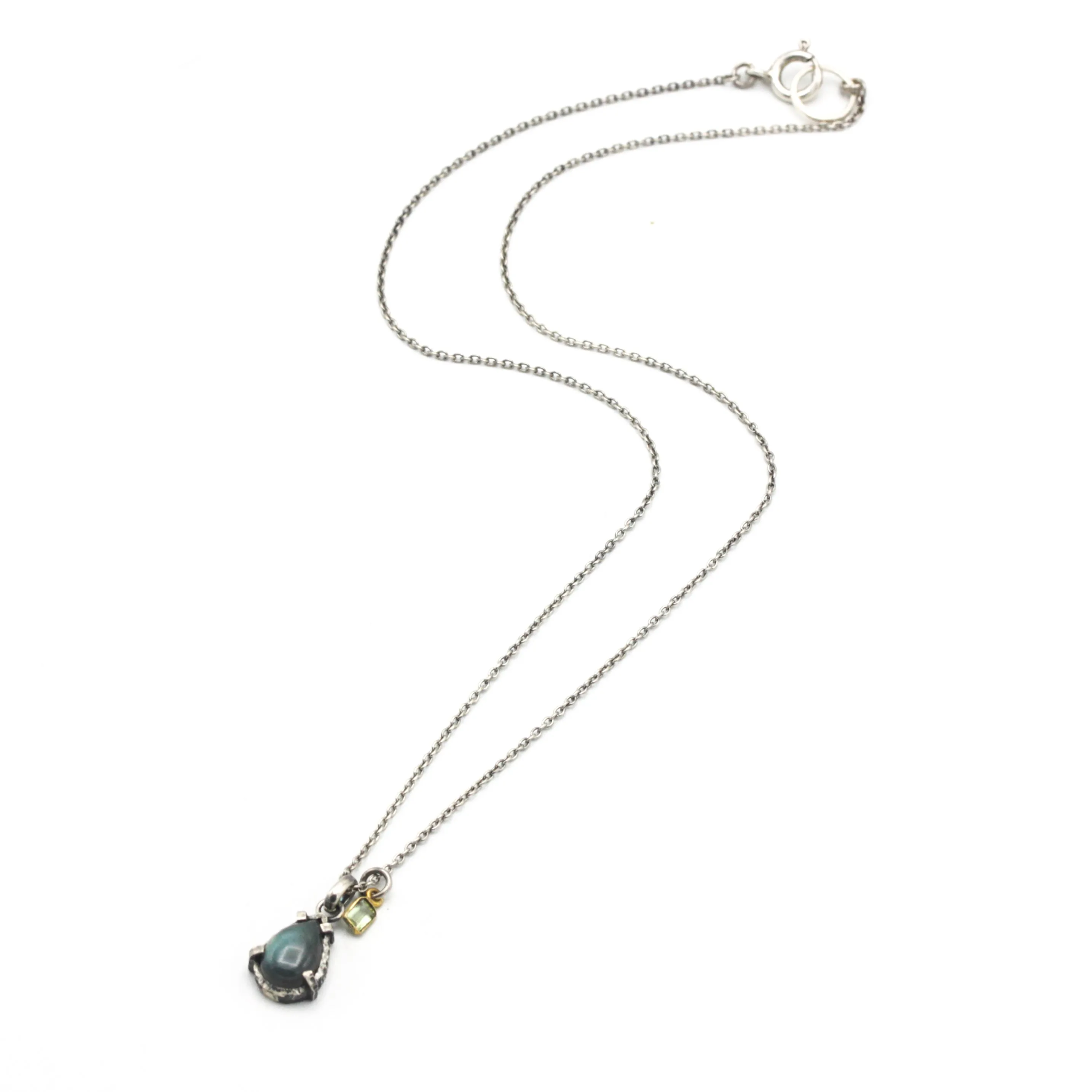 Tiny teardrop cabochon labradorite pendant necklace in silver bezel and prongs setting with green tourmaline gemstone